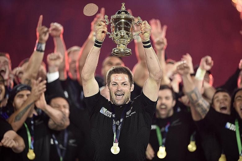 All Blacks captain Richie McCaw holding up the Webb Ellis Cup after this year's Rugby World Cup final at Twickenham, London.