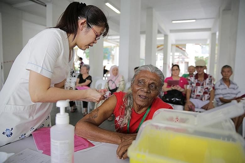 Mr Nagore Allauddeeen Ibrahim, 79, getting a flu jab at a free vaccination session conducted by Tan Tock Seng Hospital.