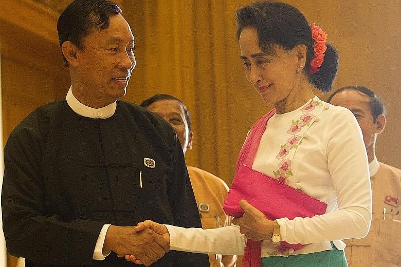 Ms Aung San Suu Kyi (right) yesterday held a closed-door meeting with Myanmar's parliamentary Speaker Shwe Mann (left) with whom she has developed an amicable working relationship.