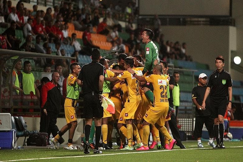 Brunei DPMM players celebrating their late winner against Courts Young Lions in their 2-1 win in September. They will be hoping to celebrate again tomorrow with a title-clinching performance.
