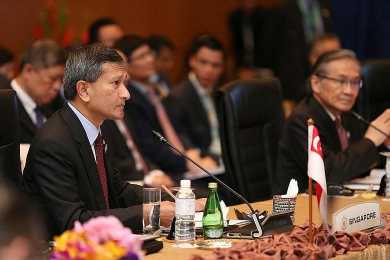 Dr Vivian Balakrishnan (left) at the Asean Summit in Kuala Lumpur yesterday. An Asean-China FTA upgrade "will enhance opportunities for trade, investments and for people to people engagement", he said.