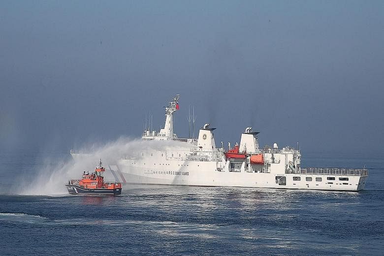 A Taiwanese patrol boat using a water cannon to repel a "foreign fishing boat" during a drill held off the coast of Kaohsiung, in southern Taiwan, on Tuesday. On Thursday, Taiwan's Foreign Ministry said that Taiwan and the Philippines have signed a f