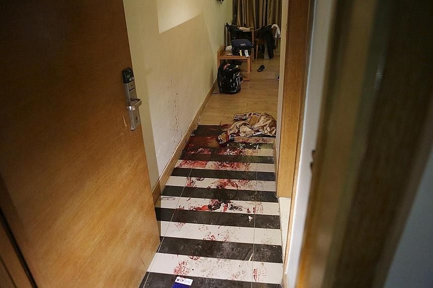 Blood-soaked drapes (above) on the floor of the Radisson Blu Hotel in Bamako after Friday's terror attack. Police yesterday cordoned off the hotel (left). Investigators are hunting at least three suspects linked to the assault.