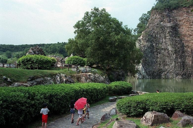 Some of Singapore's oldest rock formations can be found in Xiao Guilin (above). The park's wildlife also draws anglers and shutterbugs (left).