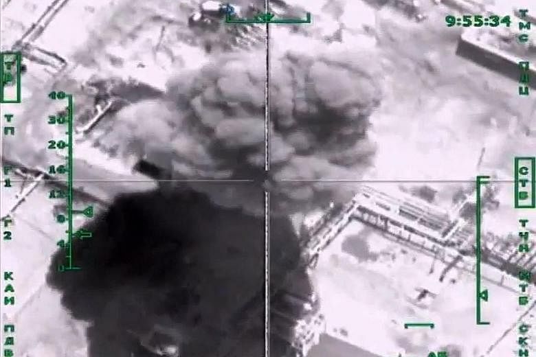 Video footage showing smoke from a bombed ISIS oil refinery in Syria targeted in a Russian air strike.