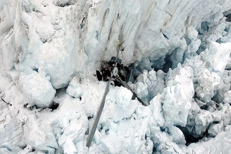 The sightseeing helicopter plunged into Fox Glacier during bad weather yesterday.