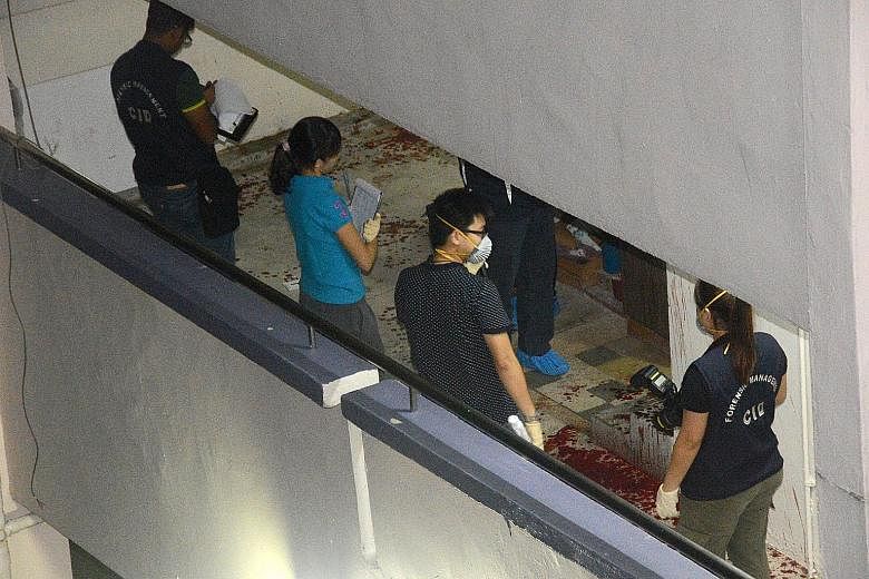 Retiree William Wong (top) had dinner with his wife Winnie Teo (above) before returning to their flat, where he was later found dead. Investigators outside Madam Winnie Teo's flat in Yishun Ring Road. Pools of blood were seen at the entrance, and the
