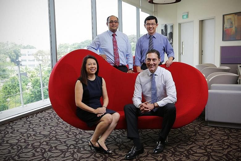 NUH doctors (clockwise from top left) Asim Shabbir, Koh Liang Piu, Theodoros Kofidis and Anita Lim are among medical professionals from overseas who have made Singapore their home. Dr Asim and Dr Koh, originally from India and Malaysia respectively, 