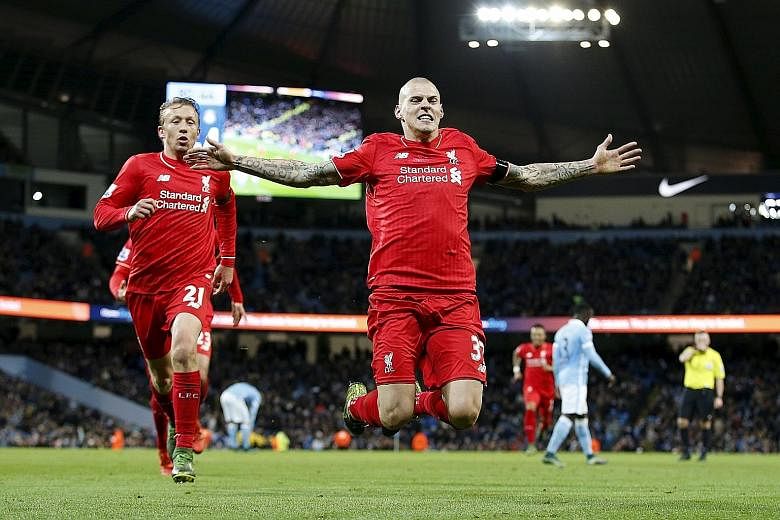 An airborne Martin Skrtel celebrating scoring the fourth goal for Liverpool in the 4-1 victory against Manchester City in their English Premier League encounter at Etihad Stadium on Saturday.