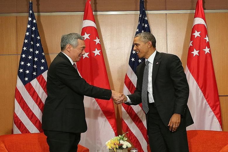 Prime Minister Lee Hsien Loong and US President Barack Obama in Kuala Lumpur yesterday. Mr Obama said that around the world, "people admire the incredible progress Singapore has made in creating prosperity and opportunity for its people and for being