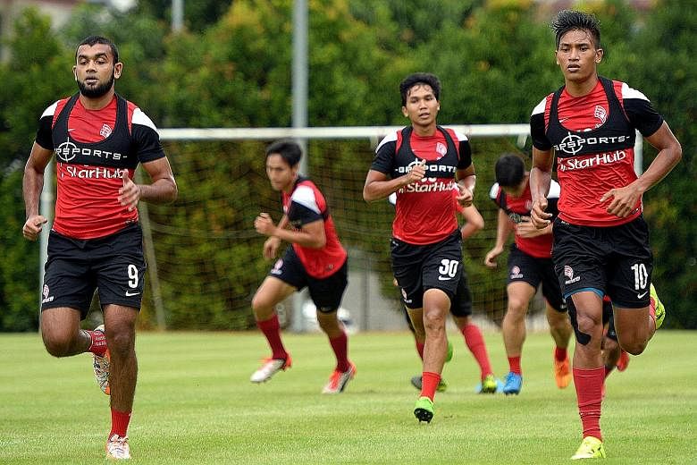 Khairul Nizam (No. 10) during a LionsXII training session on Nov 20. His return from a knee injury brings the dual benefit of aerial power and physical strength as he presses his claims for a starting place in the side that will play the first leg of
