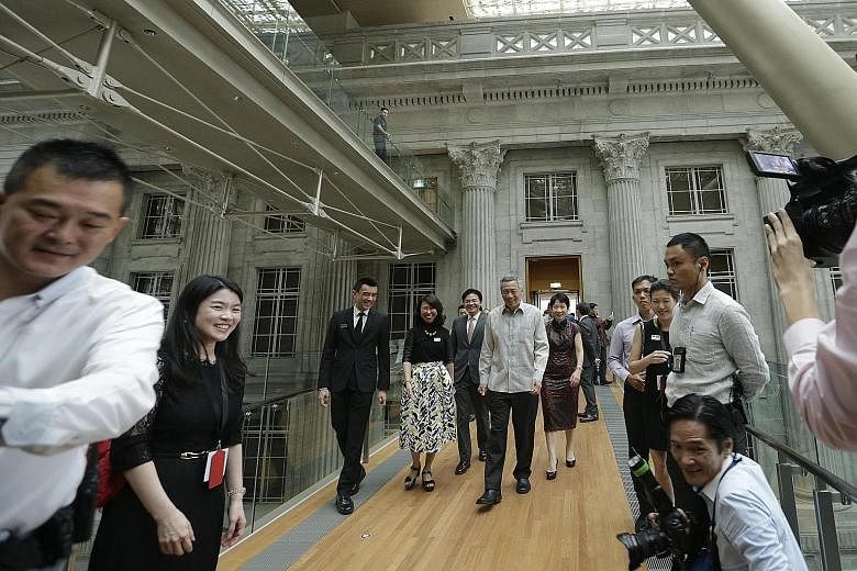 (Centre, from left) National Gallery Singapore director Eugene Tan, National Gallery Singapore chief executive Chong Siak Ching, National Development Minister Lawrence Wong, PM Lee Hsien Loong and Minister for Culture, Community and Youth Grace Fu cr