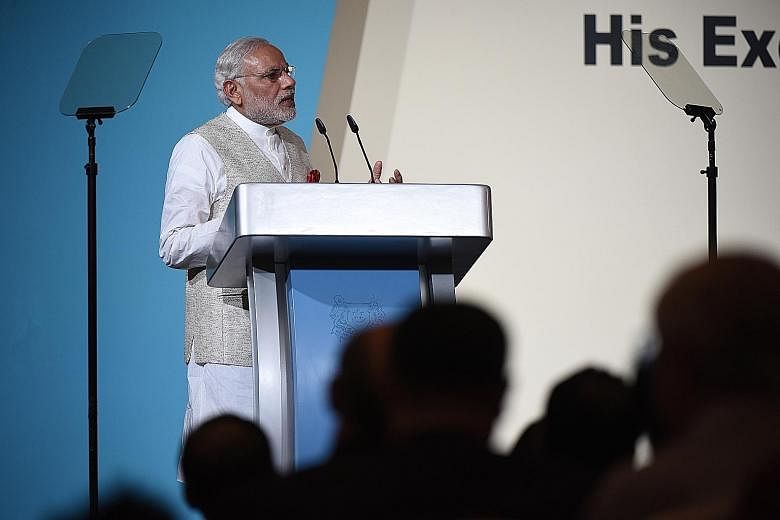 Indian Prime Minister Narendra Modi speaking at the 37th Singapore Lecture at the Shangri-La Hotel yesterday, attended by an audience of more than 1,000, including students (far right) from DPS International School, an Indian international school in 