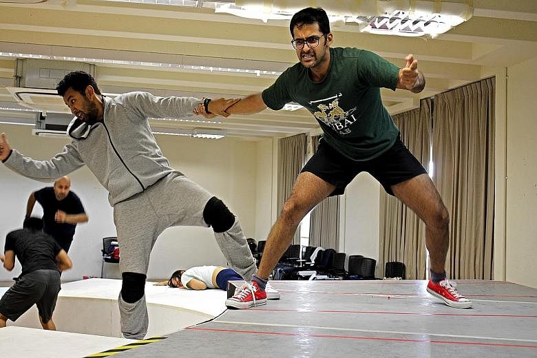 Pavan J. Singh (left) with cast member Ghafir Akbar during rehearsals.