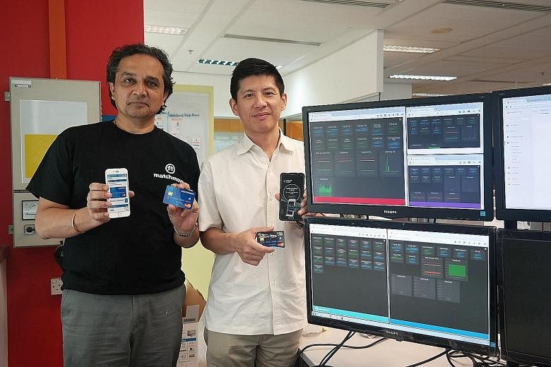 MatchMove Pay's CEO Shailesh Naik (left) and chief operating officer Hsueh Huah Leow with their firm's flagship innovation, the MatchMove virtual card, and its latest product, the MatchMove card, which is the physical version of the virtual card.