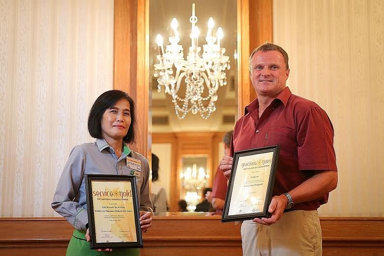 Restaurant employee Helen Goh won a gold award for service, while engineer Ad Broere won an award for being a gracious hotel guest.