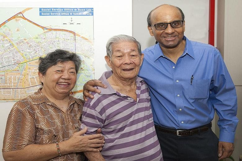DPM Tharman Shanmugaratnam (at right) with Taman Jurong residents and Cluster Support beneficiaries Madam Lau Kang Ngoh, 69, and her husband Ching Chen Chooi, 89, at NTUC Health's new Cluster Support office.
