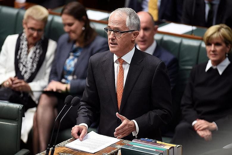 Australian Prime Minister Malcolm Turnbull speaking to Parliament in Canberra yesterday. Although he ruled out the use of Australian troops on the ground in Syria or Iraq, he said his government was planning greater intelligence-sharing with South-ea