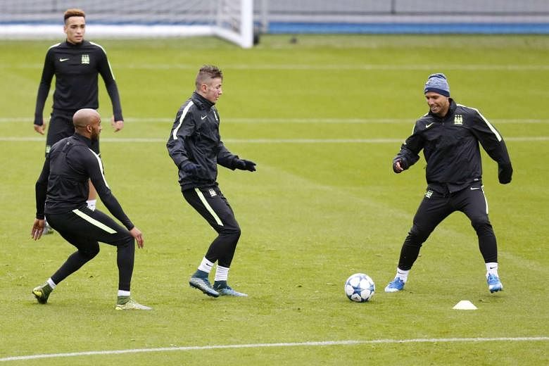 Man City's Sergio Aguero (left) and Fabian Delph (far left) during training. Having qualified for the last 16, City want a win in Turin tonight to seal top spot in Group D and avoid top guns in the last 16. 