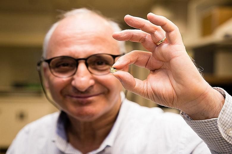 Prof Rachid Yazami holding the smart chip he developed. Embedded in a rechargeable battery, the chip optimises how the battery is charged and can reduce charging time to 10 minutes or even less, says the NTU researcher. (Below) The chip compared to a