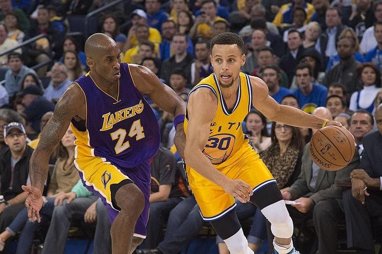 Stephen Curry (No. 30) has things under control against Los Angeles Lakers forward Kobe Bryant, as the all-conquering Golden State Warriors easily overwhelm their rivals 111-77 at home.