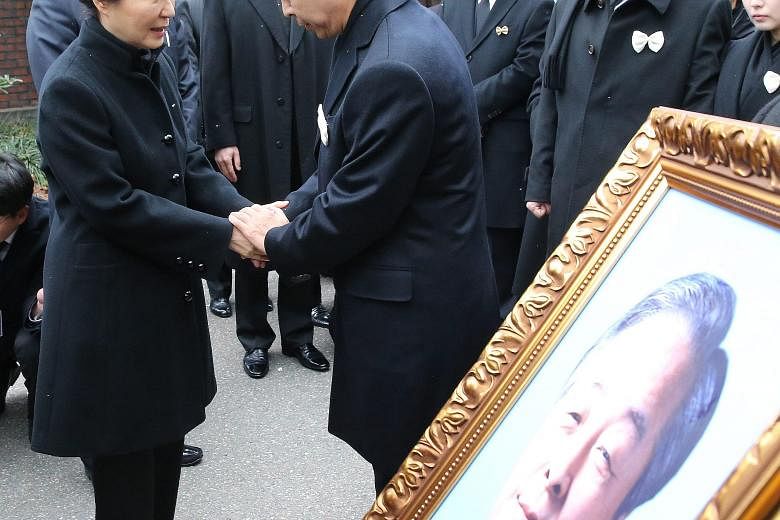 South Korean President Park Geun Hye comforting Mr Kim Hyun Chul, son of late former president Kim Young Sam, who died on Sunday after a blood infection.