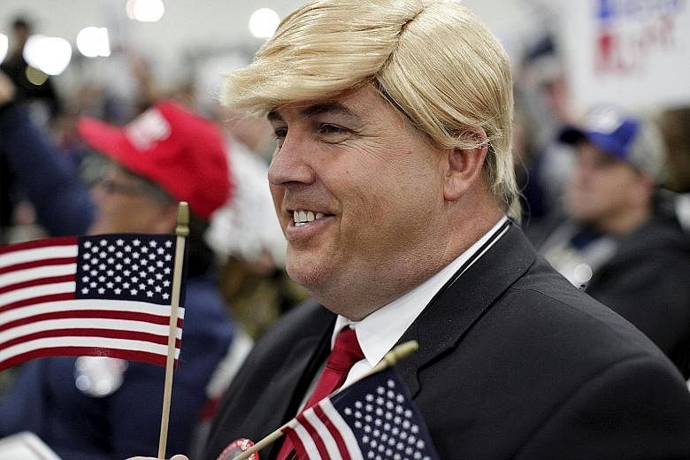 A Donald Trump lookalike showing his support for the Republican front runner at a rally in Myrtle Beach in South Carolina on Tuesday. Mr Trump's campaign has shown great resilience, and he remains atop all major new polls.