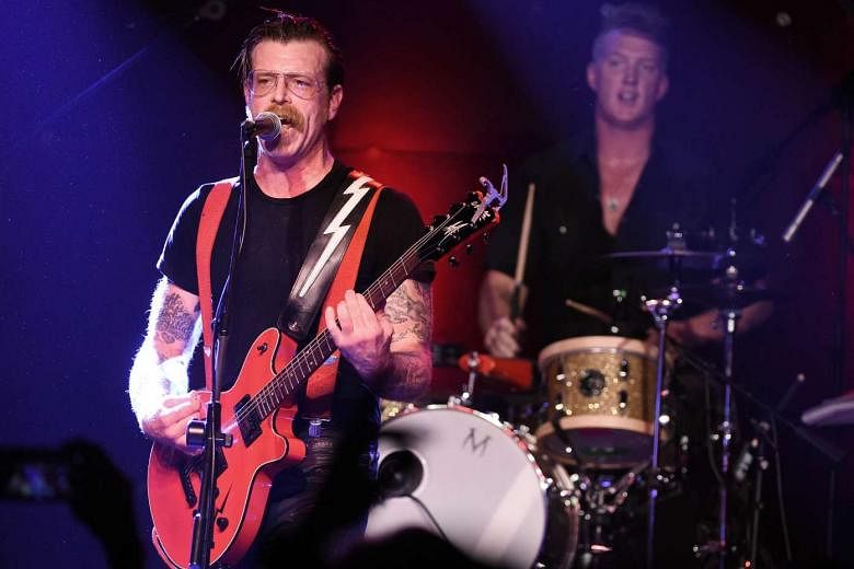 Eagles Of Death Metal singer Jesse Hughes (far left, with the band’s cofounder Josh Homme) says he cannot wait to go back to perform at Bataclan.