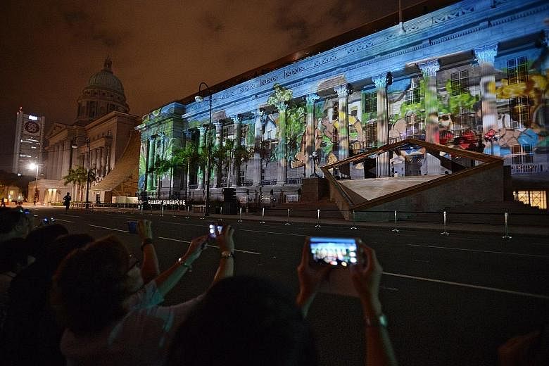 Images being projected onto the facade of the National Gallery Singapore, for the Share the Hope Facade Show, at its grand opening last night. SEE TOP OF THE NEWS A10