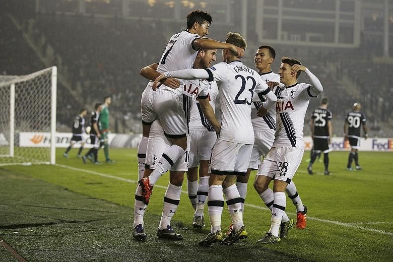 Harry Kane (second from left) celebrating with team-mates after scoring what turned out to be the winner for Tottenham against Qarabag in Baku. The 1-0 victory put them top of Group J and confirmed their entry into the Europa League round of 32.