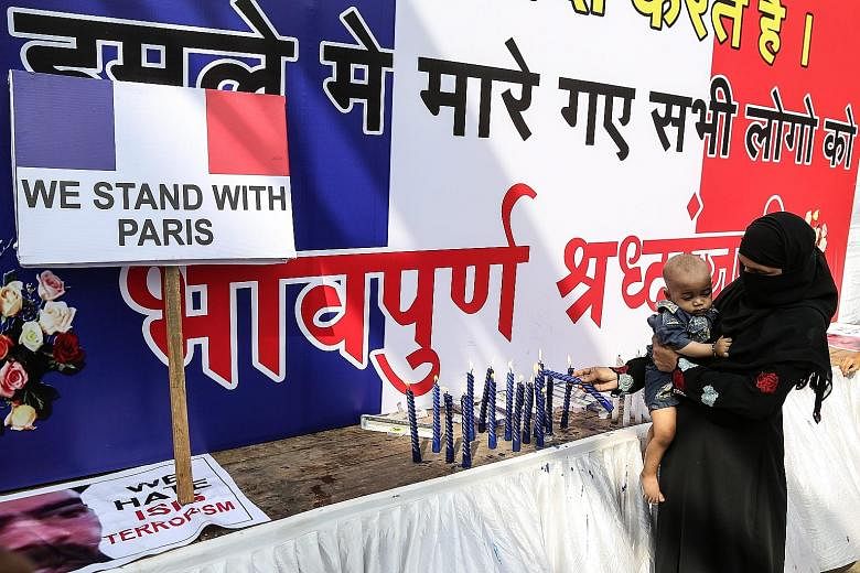 An Indian Muslim woman in Mumbai lighting candles on Nov 16 to express solidarity with France. The notion of takfir is central to the ideology of most of today's Islamist militant groups, who have killed far more Muslims than non-Muslims.