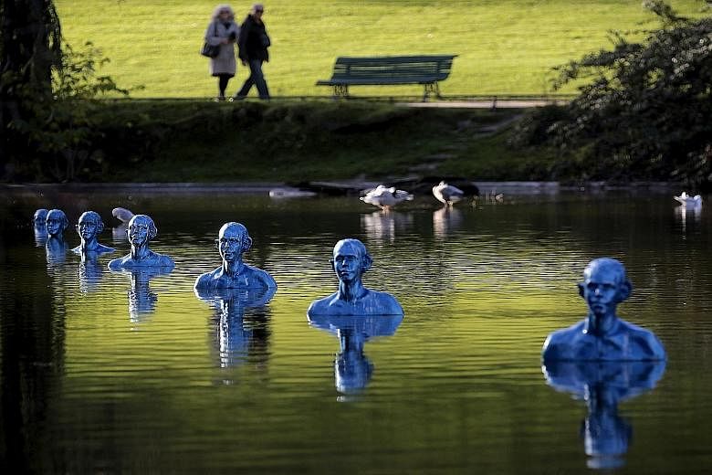 On display at the Montsouris park in Paris is the artwork Where The Tides Ebb And Flow by Argentinian artist Pedro Marzorati. The artist has said that his work represents people already sinking into the sea or who face the threat of being swallowed u