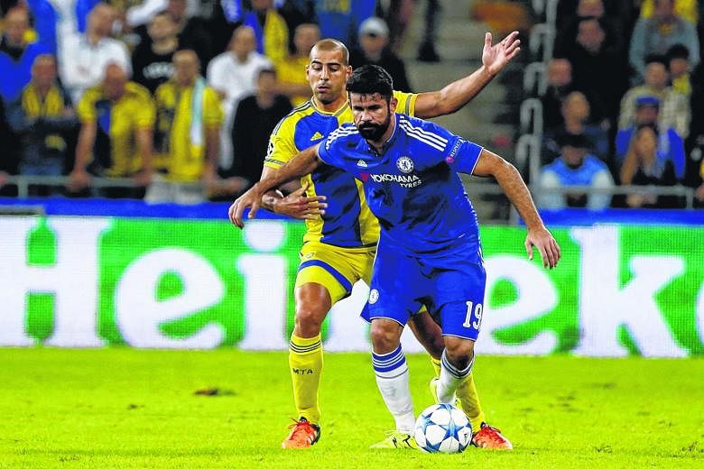 Maccabi Tel Aviv's Tal Ben Haim trying to dispossess Chelsea's Diego Costa. The Blues had it easier after their former player was sent off but even with two days less rest, Spurs' form gives them the edge today.