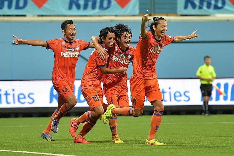 Albirex Niigata celebrating their Singapore Cup win on Friday night to complete the Cup double. There are calls for Singapore internationals to be spread among the local S-League clubs.