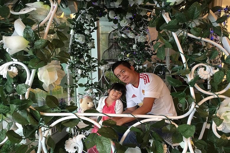 Mr Jag Kuo with his daughter Hazel. Mr Kuo is a lifelong fan of Manchester United Football Club. He writes to the Forum page on issues such as local politics, government policies and finance.