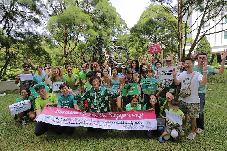 Some of the green campaigners who gathered at Highgate Condominium yesterday who pledged to reduce their carbon footprint.