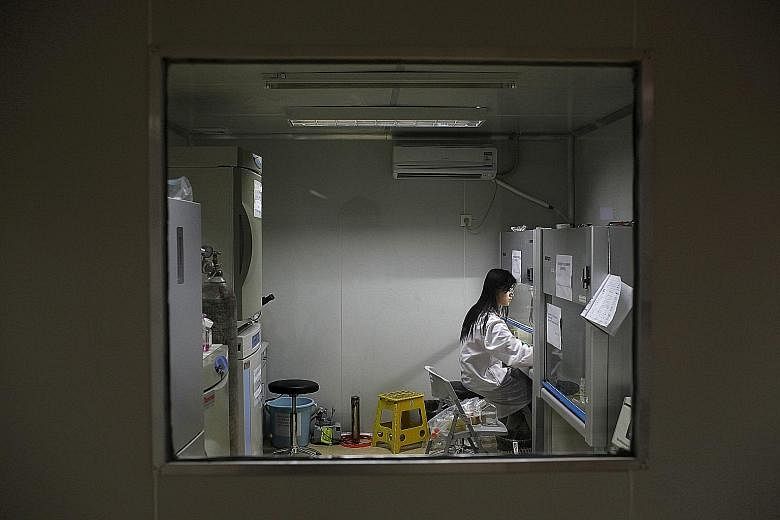 A researcher preparing medicine at a laboratory in China, the world's second-biggest drugs market behind the United States. A global powerhouse in other high-tech areas, it is now rising to the challenge of making more of its own drugs for a vast and