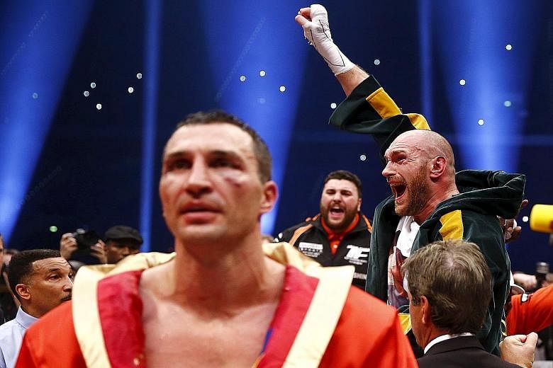 A triumphant Tyson Fury celebrating after his unanimous points win which ended Wladimir Klitschko's run of 19 straight title defences. The Briton aims to be the most charismatic world heavyweight champion since Muhammad Ali, who won the title three t