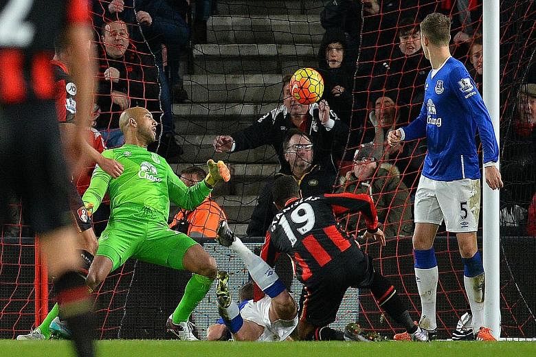 Everton goalkeeper Tim Howard could only watch in vain, as Bournemouth midfielder Junior Stanislas (right) scores his team's second goal in the thrilling 3-3 draw.