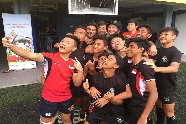 Schoolboy rugby players with former All Black Scott Waldrom (in hat) at the Heroes in the Making training camp yesterday.