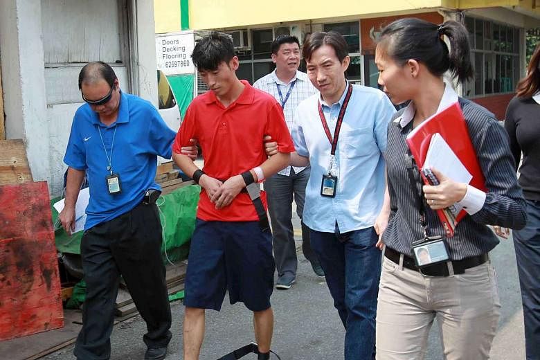 Chinese national Li Yongxiang revisiting the crime scene on June 24, 2013. Li had originally been charged with murder, but a government psychiatrist found that he had a major depressive episode at the time, reducing his mental responsibility for his acts.