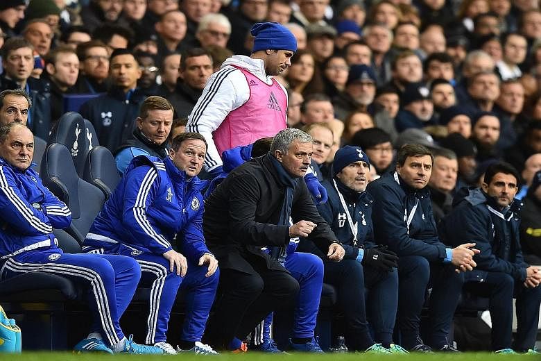 Diego Costa (in pink bib) did not look too pleased when he was axed from the starting XI in Chelsea's match against Tottenham. The striker's form has dipped and he has scored only seven goals for the Blues since January.