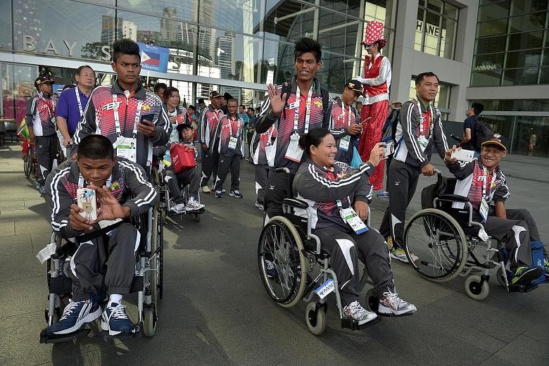Athletes and officials from Myanmar attending a team welcome ceremony yesterday, at which the Asean Para Games was hailed as an important platform to help forge a stronger regional identity.