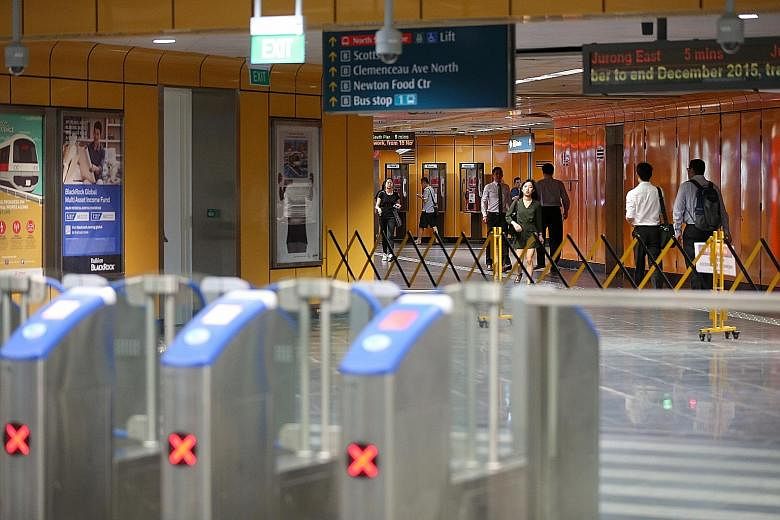 Commuters on the DTL2 must tap out of the fare gantries at Newton MRT station (above), and tap in again, to get on the North-South Line