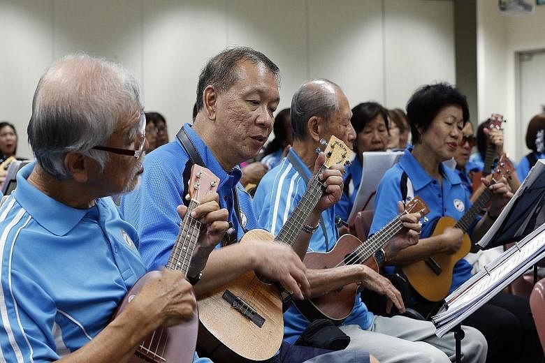 Members of the Bishan Ukes jamming during a session at the Bishan Community Club last month. The group comprises mostly people in their 50s and 60s who meet every Thursday evening to play the ukulele together.