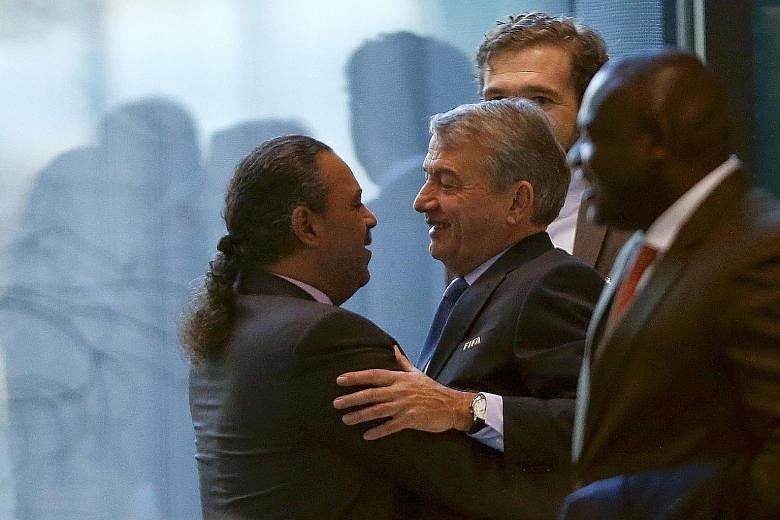 Fifa executive committee member Sheikh Ahmad Al-Fahad Al-Sabah of Kuwait (extreme left) welcoming Wolfgang Niersbach at Fifa's headquarters in Zurich.