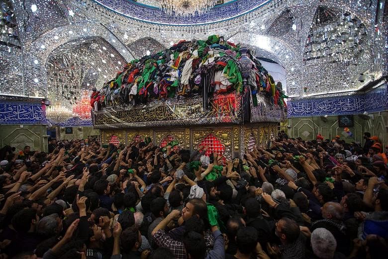 Shi'ite pilgrims gathering at the Imam Hussein shrine during a ceremony marking Arbain in the holy city of Karbala in southern Iraq this week. Iraqi Shi'ites visit Karbala to perform the ceremony of Arbain on the 40th day after the Shi'ite holy day o