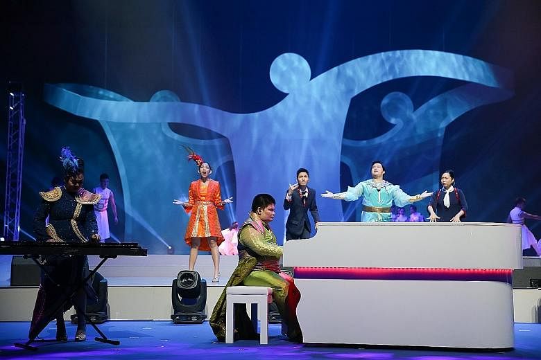 Above left: Last night's show, which featured more than 1,400 performers, who were able-bodied as well as disabled, was rich with the theme of inclusiveness and tolerance. Above right: Team Singapore marching in during last night's opening ceremony a