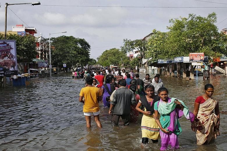 Severe flooding in Chennai has cut off basic services in the city and forced some residents to wade to evacuation areas. The navy has also had to use fishing boats to rescue people living in the worst-hit suburbs.