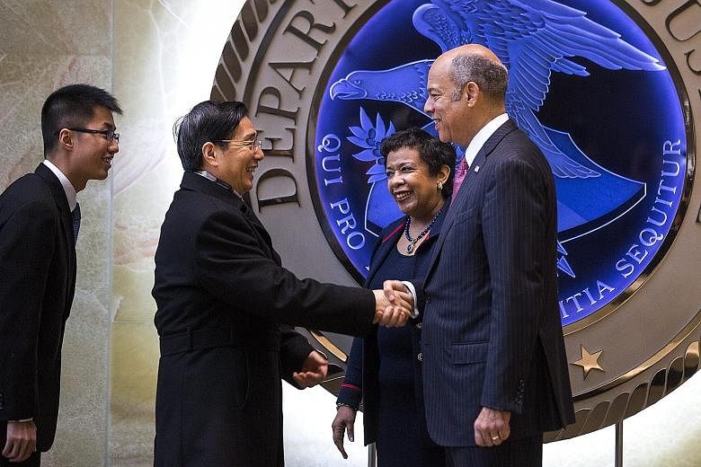 China's Minister for Public Security Guo Shengkun being welcomed by US Attorney- General Loretta Lynch and Homeland Security Secretary Jeh Johnson before their meeting on Wednesday.